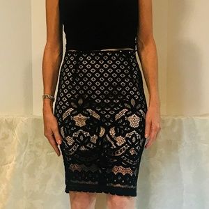 Black lace over nude slip